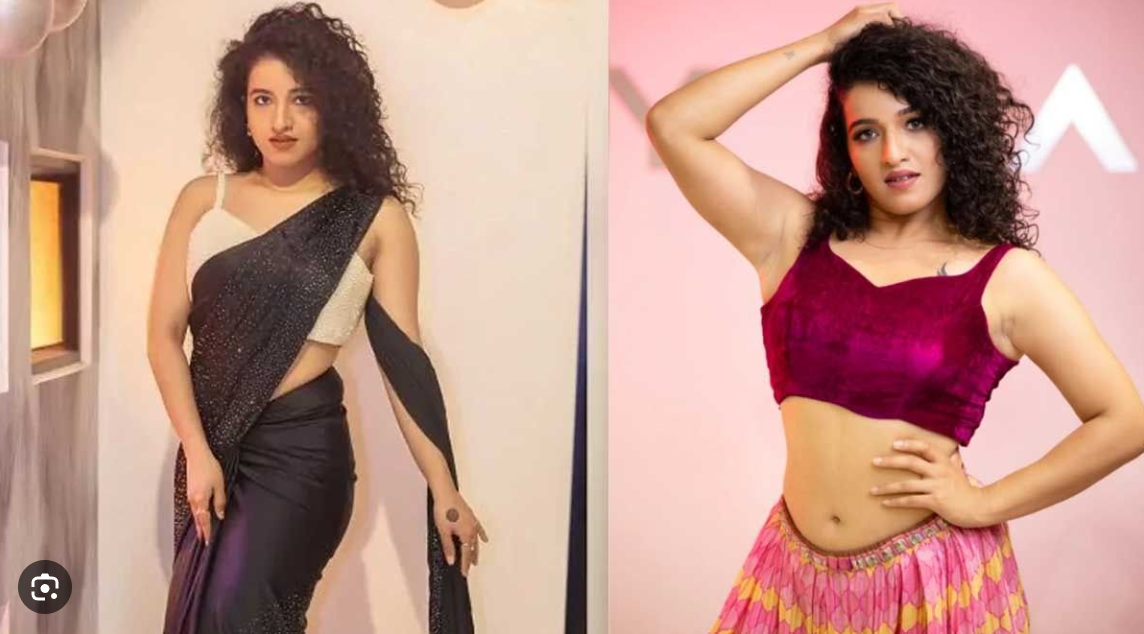 கெமி தனது மடியில் ஒரு புலிக்குட்டியை வைத்துக்கொண்டு பால் புகட்டுகிறார்.