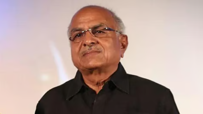 சூப்பர் குட் ஃபிலிம்ஸ் நிறுவனர் ஆர்.பி. சௌத்ரியின் புன்னகைக்கும் உருவப்படம்.